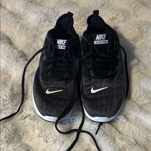 Woman’s 7.5 Nike Black and White Flex TR9 Training Sneakers